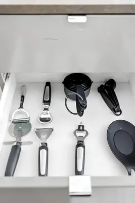 a drawer filled with different types of kitchen utensils at Trendy 1BR in TO Steps to Entertainment & Dining in Toronto