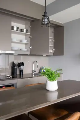 a kitchen with a table with a potted plant on it at Chic 1-Bedroom Downtown Toronto Getaway in Toronto