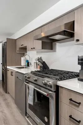 a kitchen with a stainless steel stove top oven at Modern 1-BR Condo with Parking in Downtown Toronto in Toronto