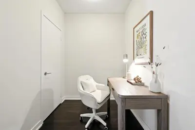 a white office with a desk and a white chair at Gorgeous 2BR in Downtown Toronto w City Views in Toronto