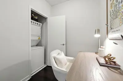 a white room with a white chair and a desk at Gorgeous 2BR in Downtown Toronto w City Views in Toronto