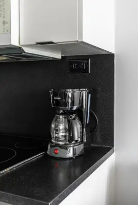 a blender sitting on top of a kitchen counter at Spacious 1 Bedroom plus Den Condo Iceboat Terrace Downtown Toronto in Toronto
