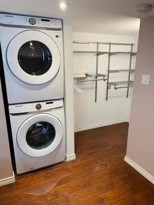 a washer and dryer in a room at Peterborough Cosy Apartment in Peterborough