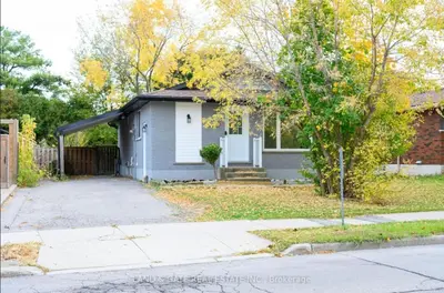 a small house with a driveway in front of it at The Hamilton Haven in Hamilton