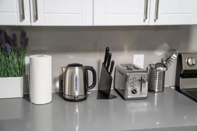 a kitchen counter with a toaster and a coffee maker at Studio Apartment B - Full Kitchen - Cozy and Modern in Brampton
