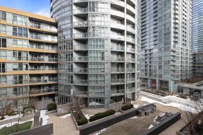 an aerial view of a large building with tall buildings at Stylish 1BR Condo with Patio Steps from Waterfront in Toronto