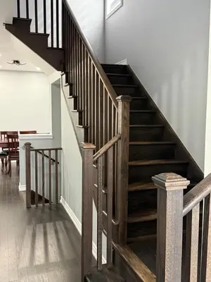 a wooden staircase in a home with white walls at masters bet room in Whitby
