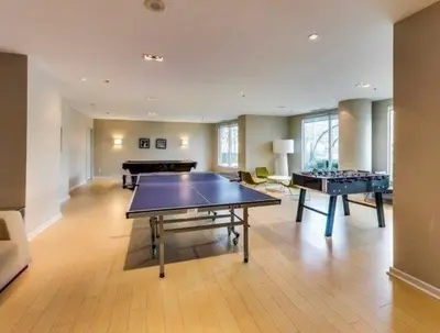 a living room with a ping pong table in it at Lakeview 1-Bedroom Condo-Downtown Toronto-Free Parking in Toronto