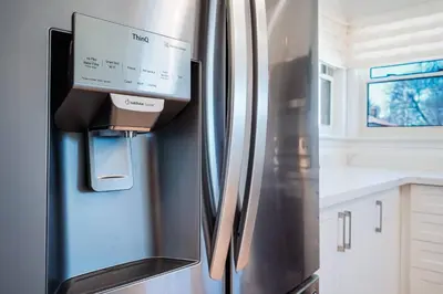 a refrigerator with a box on the side of it at Bright, Modern & Cozy Getaway Home in the GTA in Whitby