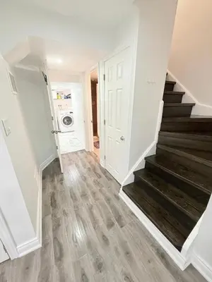 a hallway with a staircase in a house at Modern & cozy one Bedroom Basement Suite with Kitchen and parking- sleeps 4 in Mississauga