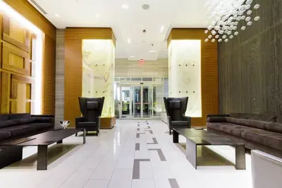 a lobby with couches and tables in a building at Luxury 1BR Suite w Skyline City Views - The Roland in Toronto