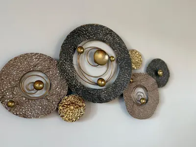 a group of gold and brown objects on a white background at Bright Escape Falls Retreat in Niagara Falls