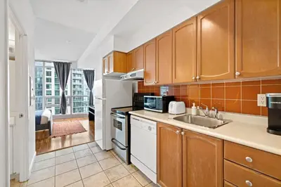 a kitchen with a sink and a counter top at Chic Fort York Studio Cozy Retreat in Downtown TO in Toronto