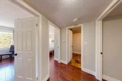 an empty room with a door and a bedroom at Wintergreen 222 in Blue Mountains