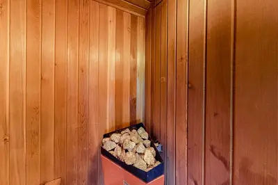 a pile of logs in a wooden wall at Wintergreen 222 in Blue Mountains