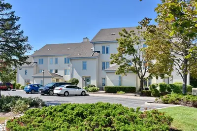 a large apartment building with cars parked in a parking lot at Sierra Lane 218 in Blue Mountains