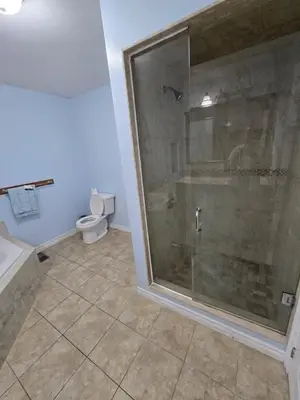 a bathroom with a shower and a toilet at Peaceful Country Home on 25 Acres of Wooded Land in Alliston