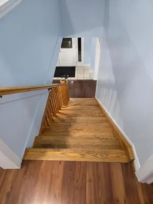 a staircase with wooden floors in a house at Peaceful Country Home on 25 Acres of Wooded Land in Alliston