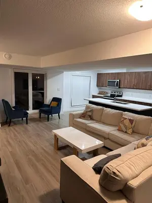 a living room with a couch and a table at Entire 3 bedroom townhouse in Cambridge