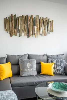 a living room with a gray couch with yellow pillows at High Floor 1 Bedroom Condo City View Downtown Toronto in Toronto