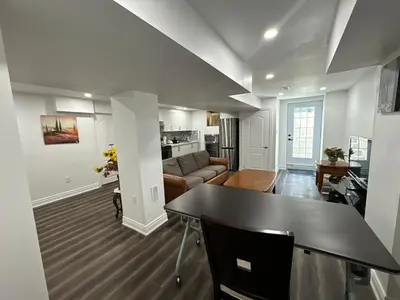 a living room with a table and a couch at Basement Suite 2 bedroom s in Oshawa