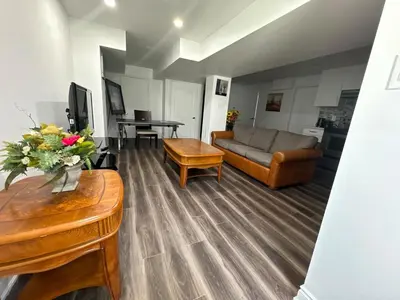 a living room with a couch and a table at Basement Suite 2 bedroom s in Oshawa