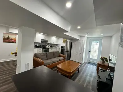 a living room with a couch and a table at Basement Suite 2 bedroom s in Oshawa