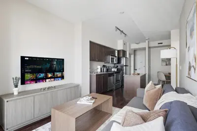 a living room with a couch and a table at Modern Lakeside 1BR Condo in Downtown Toronto in Toronto