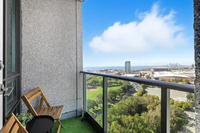 a balcony with a chair and a view of the ocean at Modern Lakeside 1BR Condo in Downtown Toronto in Toronto