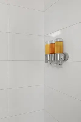 a glass jar on a white tiled wall at Modern Studio-Style Condo in Downtown Toronto in Toronto