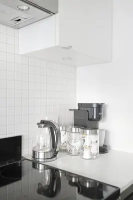 a kitchen counter with a coffee maker and a mixer at Modern Studio-Style Condo in Downtown Toronto in Toronto