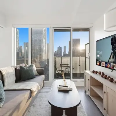 Bright 2BR Condo w Patio Central Toronto Retreat