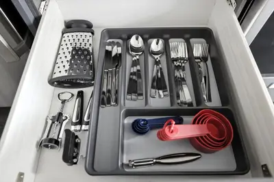 a drawer filled with utensils in a drawer at Chic DT TO Studio Getaway Perfect for Couples in Toronto