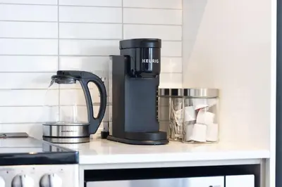 a coffee maker sitting on a counter in a kitchen at City Living Downtown Retreat Perfect Getaway in Toronto