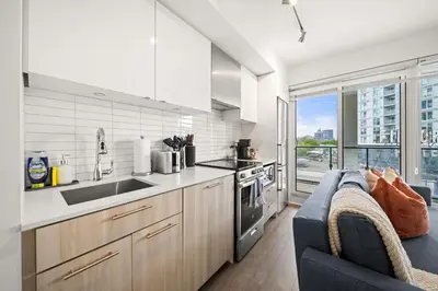 a kitchen with a couch and a counter top at City Living Downtown Retreat Perfect Getaway in Toronto