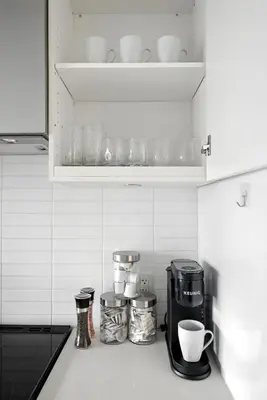 a kitchen counter top with a coffee maker and cups at Luxe Downtown Studio Near Eaton Centre & Transit in Toronto