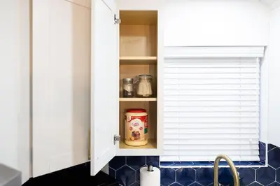 a kitchen cupboard with a jar of food in it at Stylish 3BR Urban Retreat near Christie Sleeps 6 in Toronto
