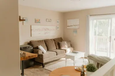 a living room with a couch and a table at The Klinck House in Collingwood