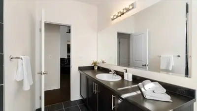 a bathroom with a sink and a mirror at Modern Bay Vista Getaways in Carrying Place