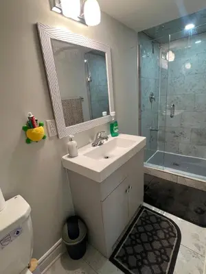 a bathroom with a sink and a shower at Basement in Brampton