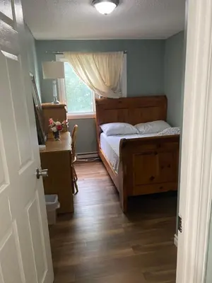 a bedroom with a bed and a window at Comfy Private Room in Brampton