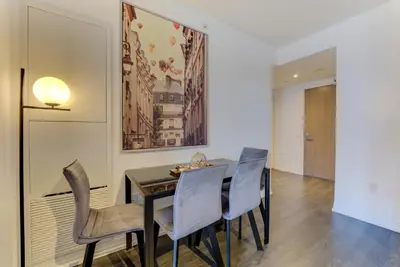 a dining room with a table and chairs at Downtown Luxury Unit in Toronto
