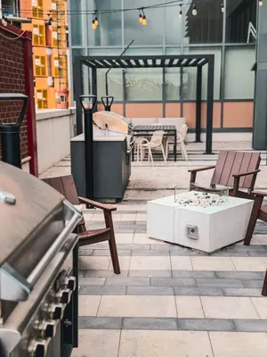 a patio with a table and chairs and a tub at LuxCondo in the Downtown Kitchener Uptown Waterloo in Kitchener
