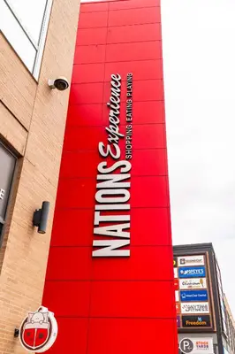 a red sign on the side of a building at Skyline Escape • 3BR Penthouse with Terrace in Toronto