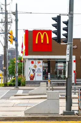 a mcdonalds restaurant with a traffic light on a street at Skyline Escape • 3BR Penthouse with Terrace in Toronto