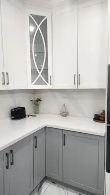 a kitchen with white cabinets and white counter tops at Toronto Guest House in Toronto