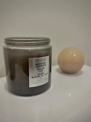 a jar of honey and a vase on a table at Your cozy Caribbean-inspired stay just 1 hour north of Toronto in Alliston