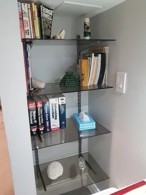 a book shelf filled with books in a room at Cozy Suite in Milton ON Keyless Entry No Pets in Milton