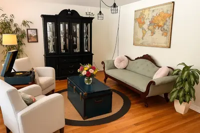 a living room with a couch and a table at Merlot Room in Old Town in Niagara on the Lake