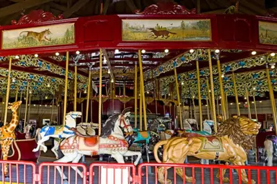a merry go round with horses on a carousel at Bobs Yer Uncle in Port Dalhousie in St. Catharines